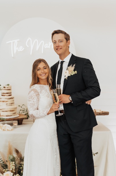 Kamryn Markus and husband at their wedding.